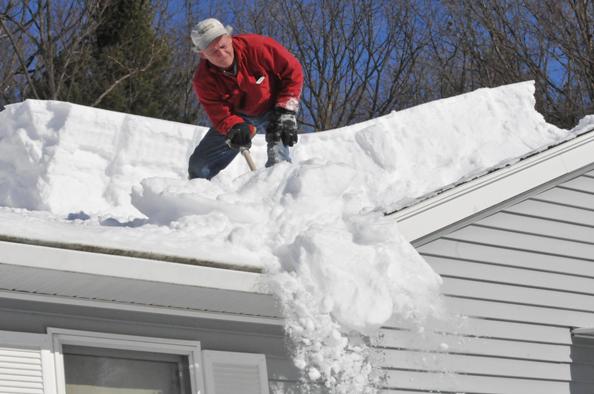 Removing snow from the roof
