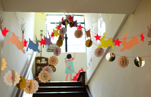 Decorating the ceiling for the New Year with garlands